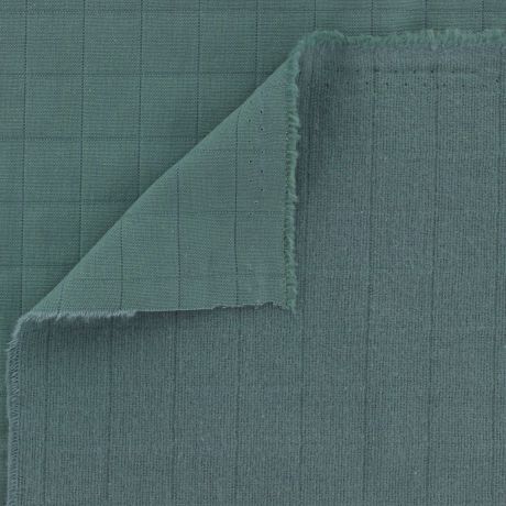 Tissu coton matelassé vert plié